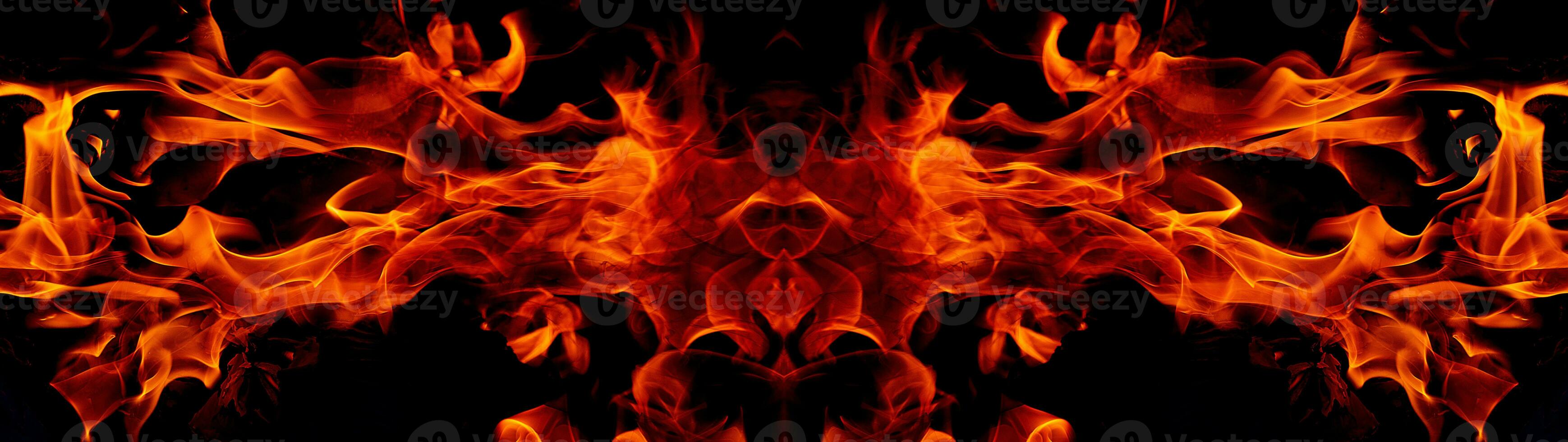 Fire flames on abstract art black background, burning red hot sparks rise, fiery orange glowing flying particles photo