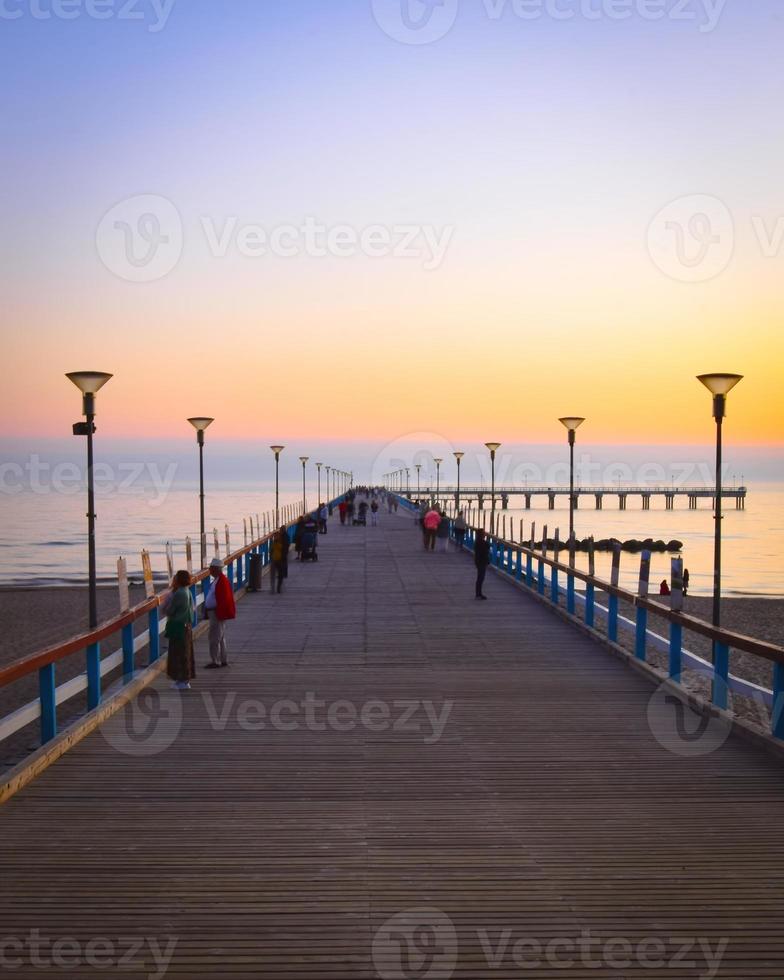 Sunset at the famous marine pier in Palanga, Lithuania photo