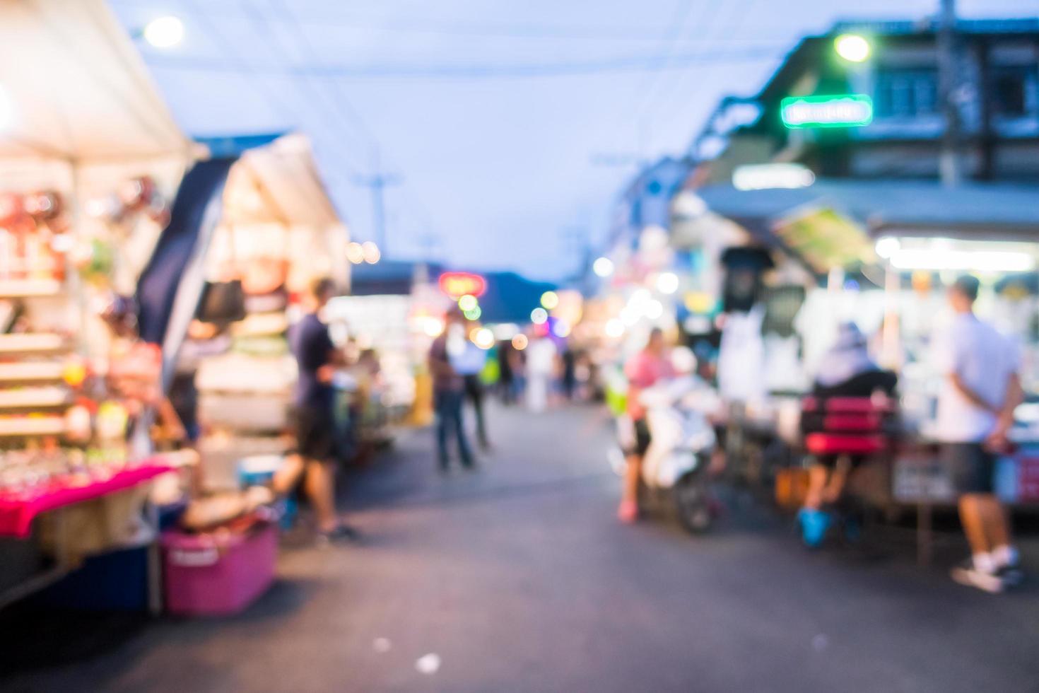 Abstract blur and defocused night local market photo