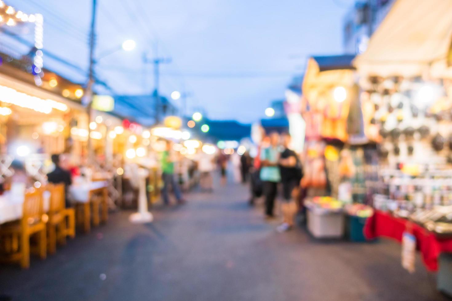 Abstract blur and defocused night local market photo