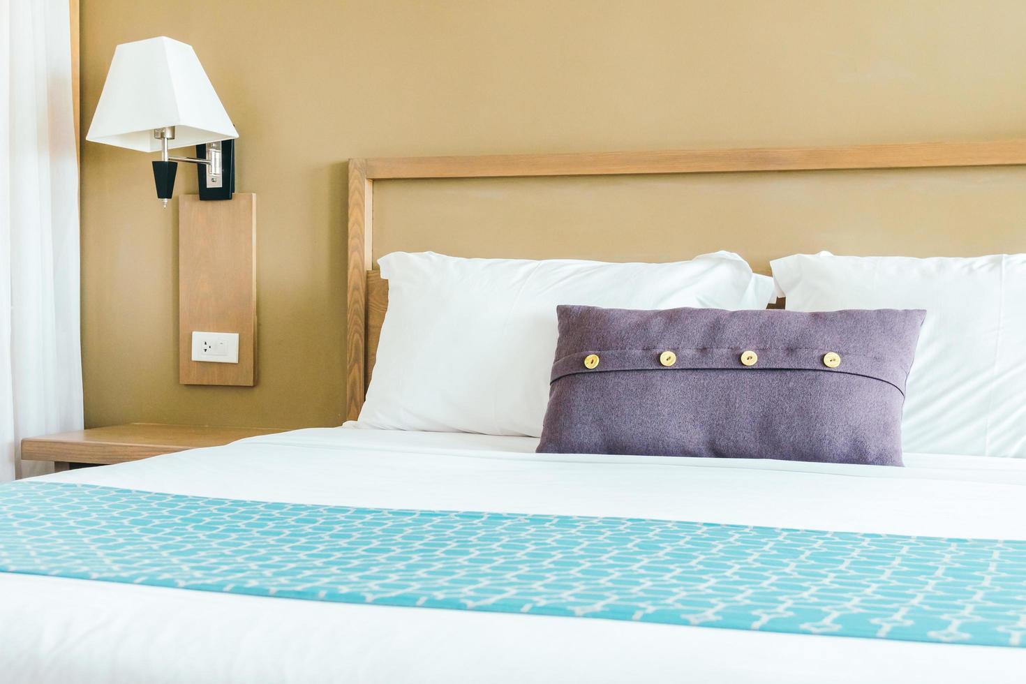 Comfortable pillow on bed photo