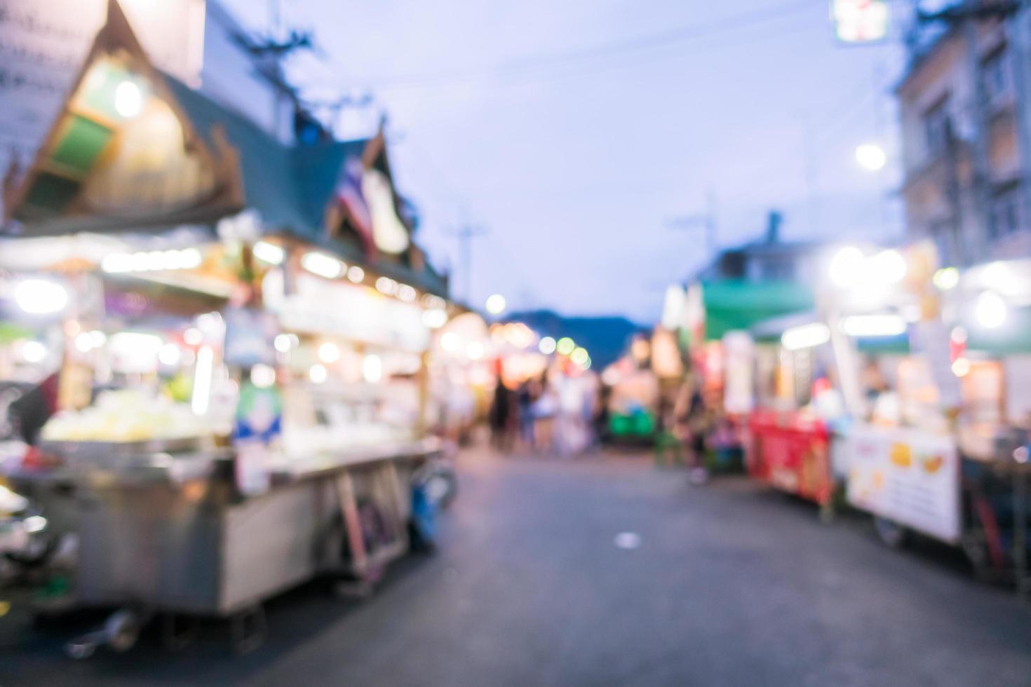 Abstract blur and defocused night local market photo