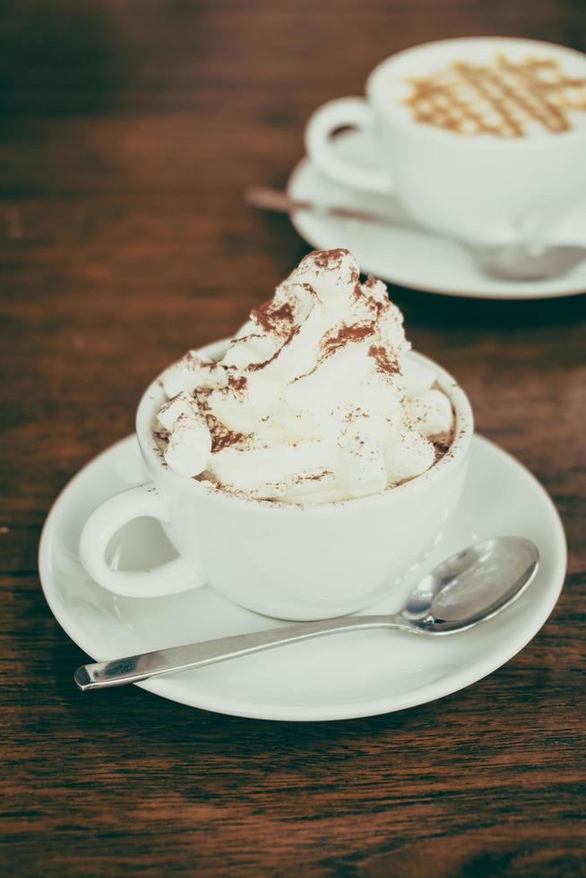 Hot marshmallow chocolate in white cup photo