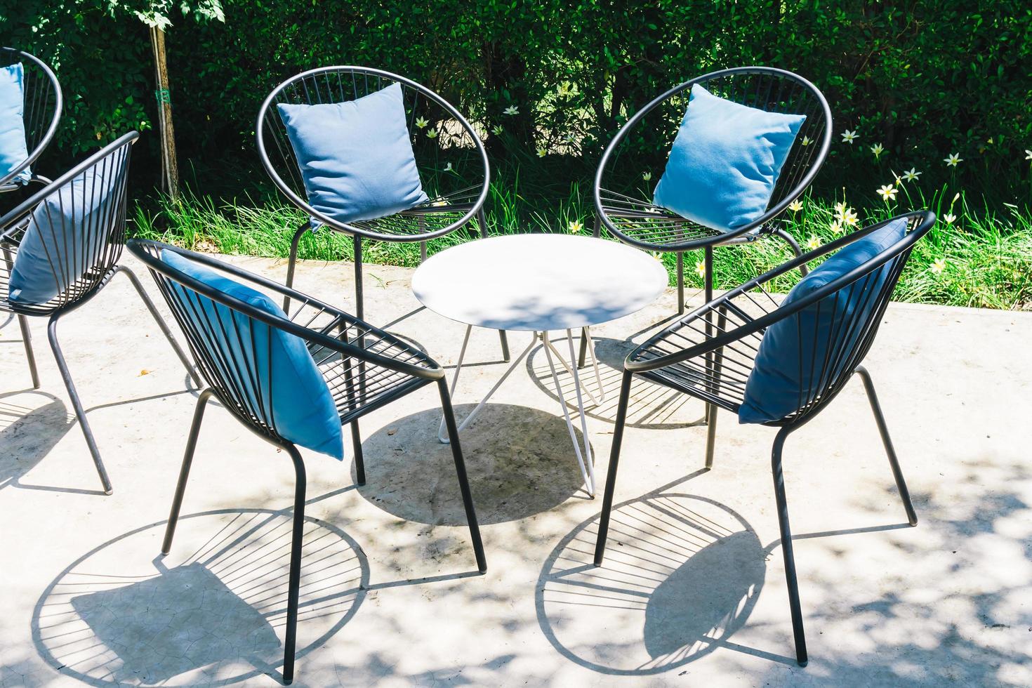 Patio with Pillow on chair and table set photo