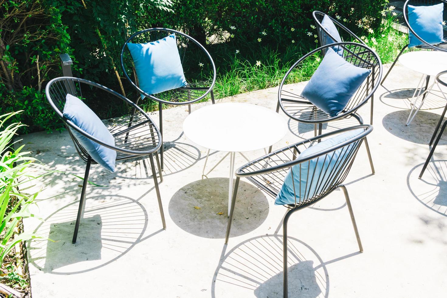 Patio with Pillow on chair and table set photo