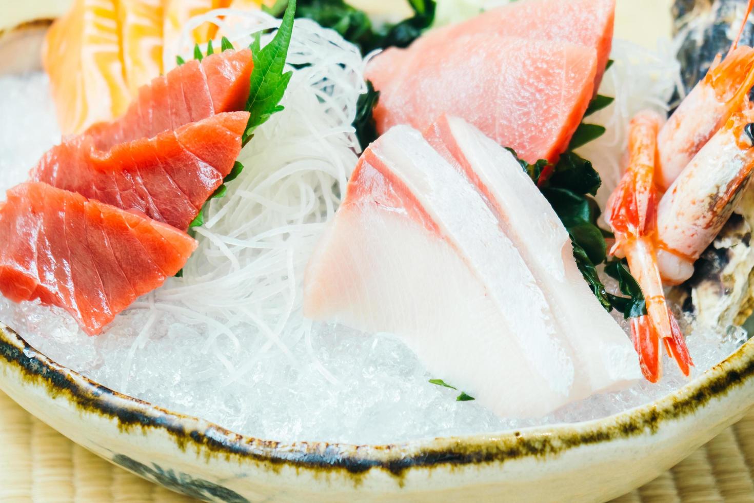 Raw and fresh salmon tuna and other sashimi fish meat photo