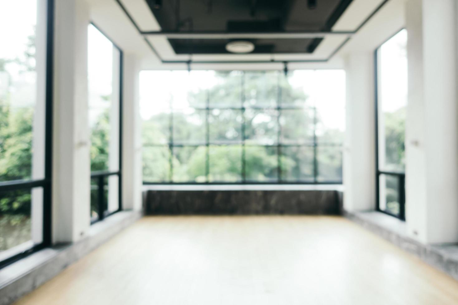 Abstract blur fitness equipment in gym room interior photo