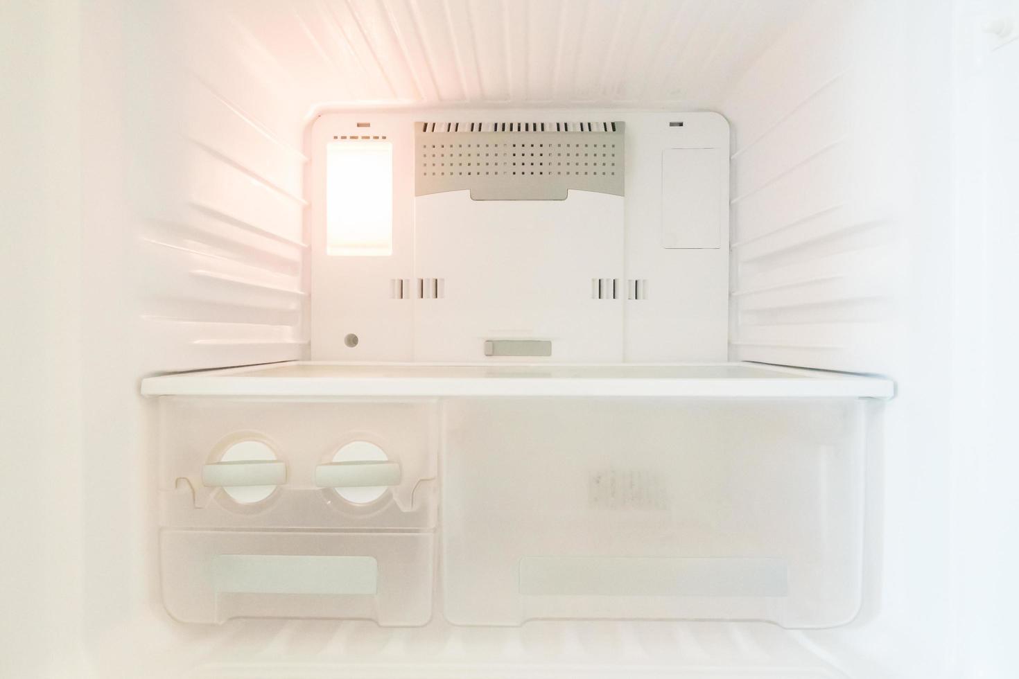 Empty refrigerator interior photo