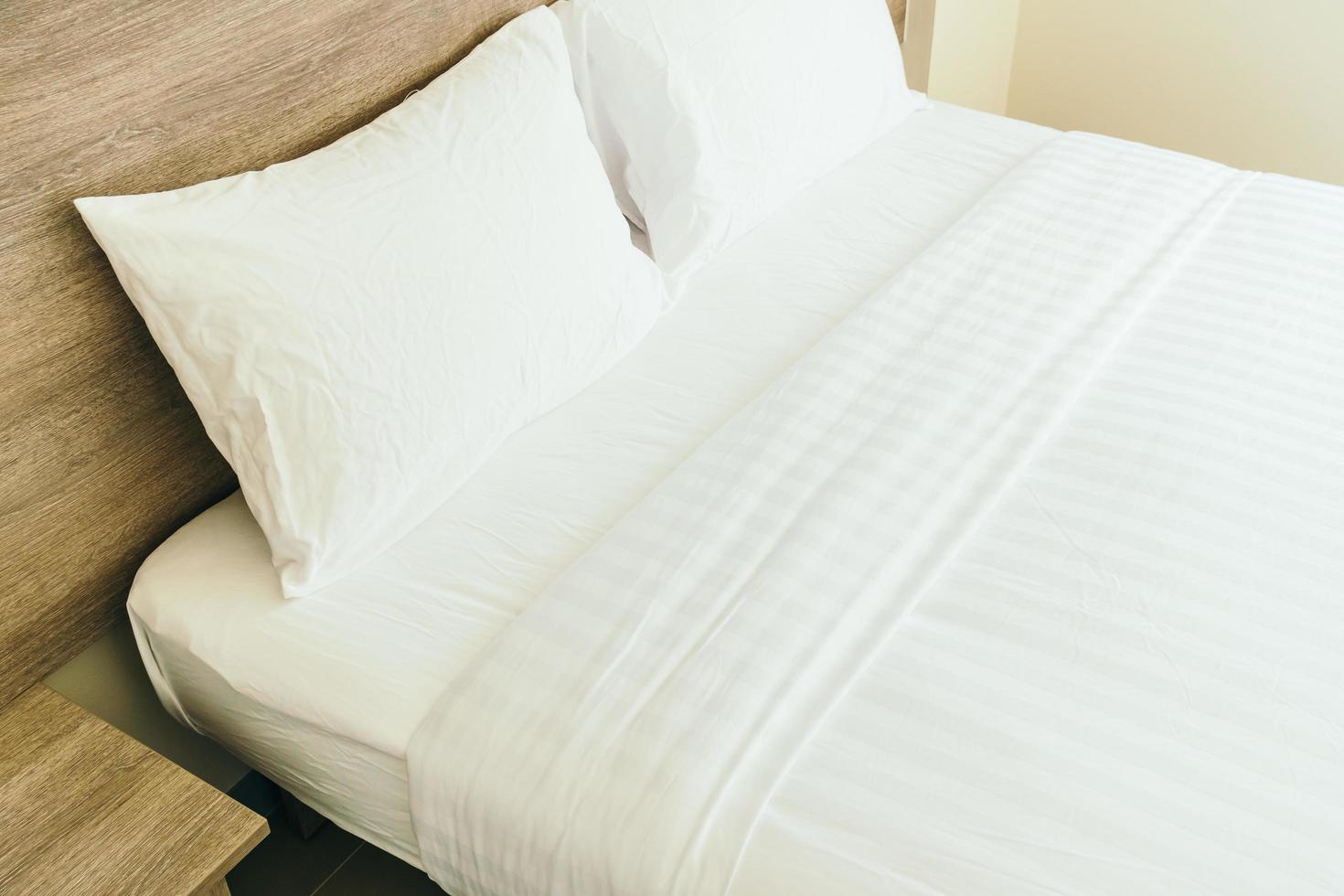 White pillow on bed photo