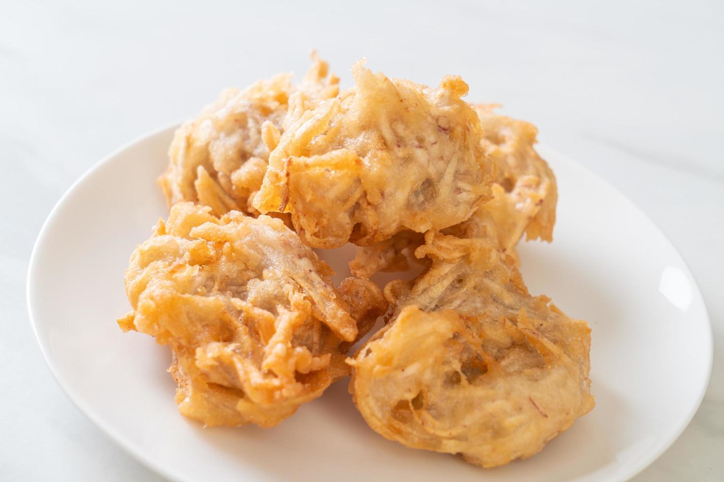 Fried taro with sauce - vegan and vegetarian food style photo