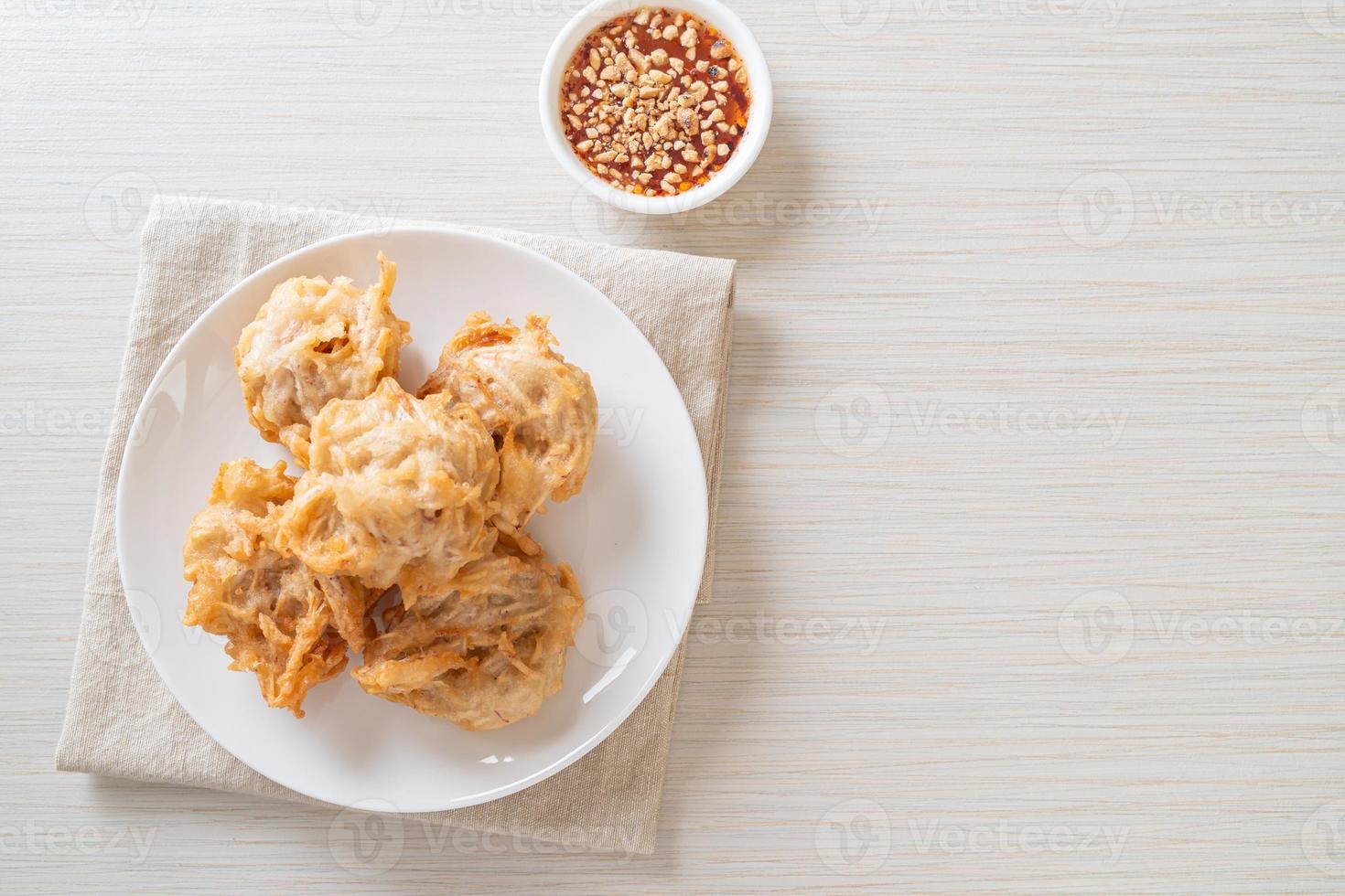 Fried taro with sauce - vegan and vegetarian food style photo