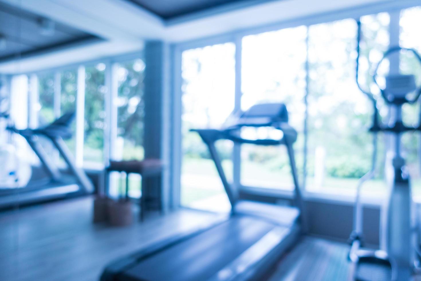 Abstract blur and defocused fitness equipment in gym interior photo