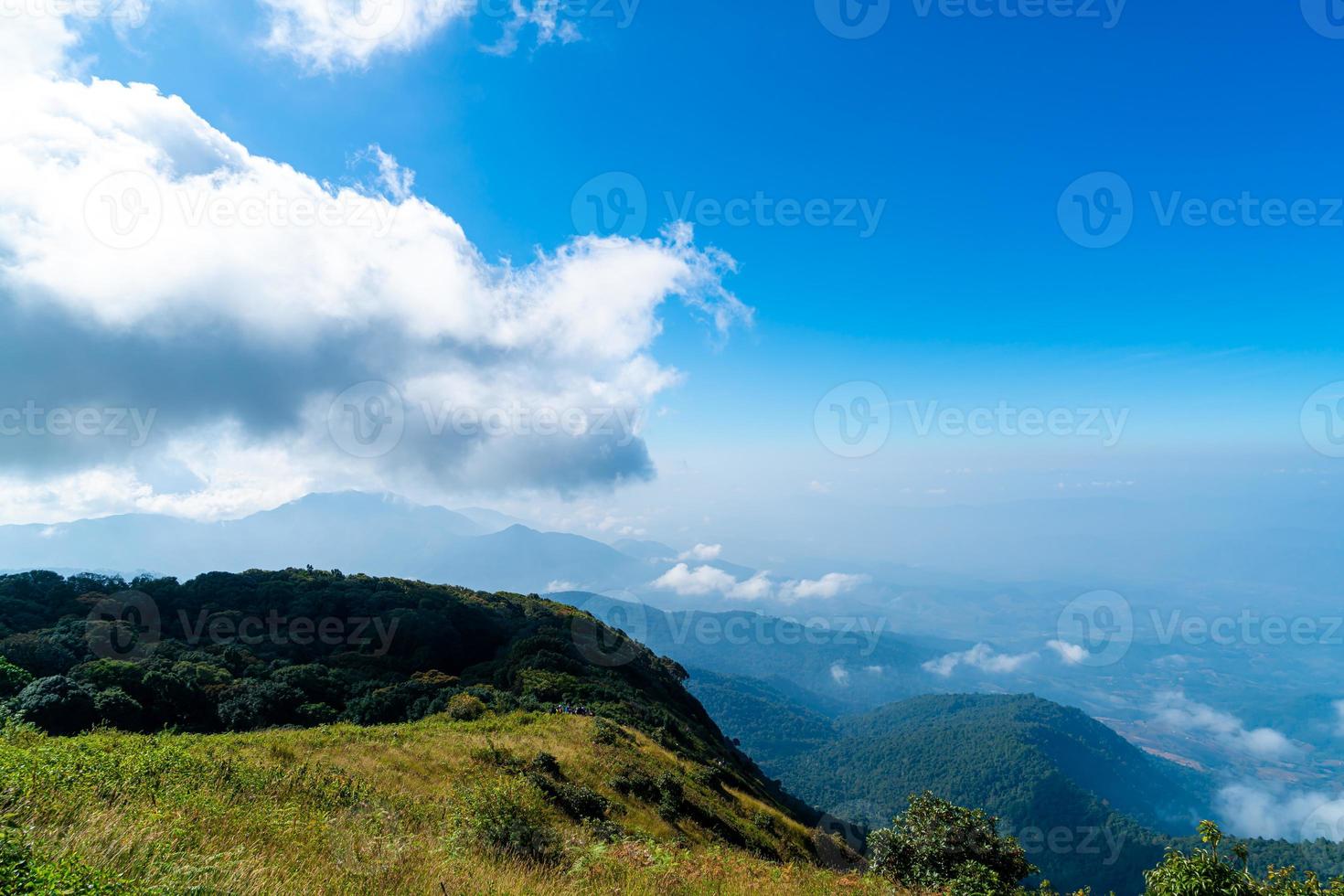 Beautiful mountain layer with clouds and blue sky at Kew Mae Pan Nature Trail in Chiang Mai, Thailand photo