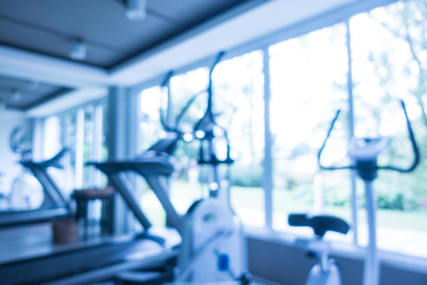 Abstract blur and defocused fitness equipment in gym interior photo