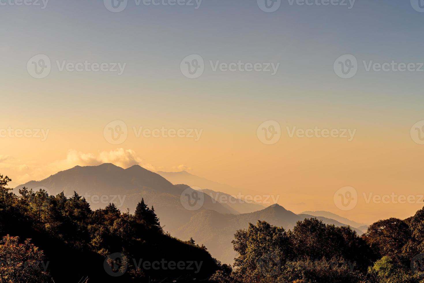 Beautiful mountain layer with clouds and sunrise at Chiang Mai in Thailand photo