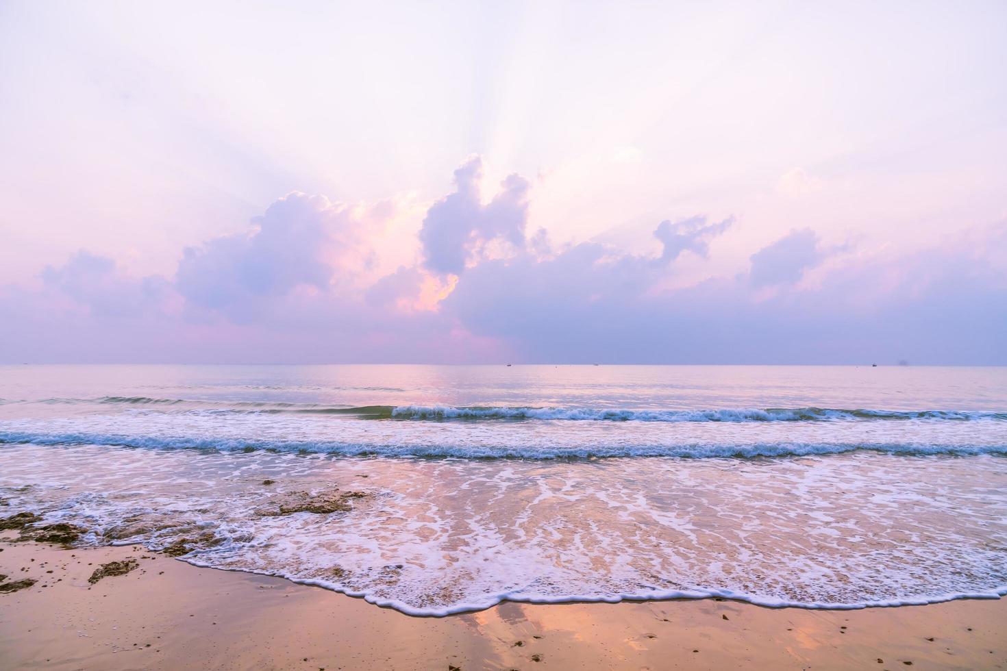 Beautiful beach and sea on sunrise time photo