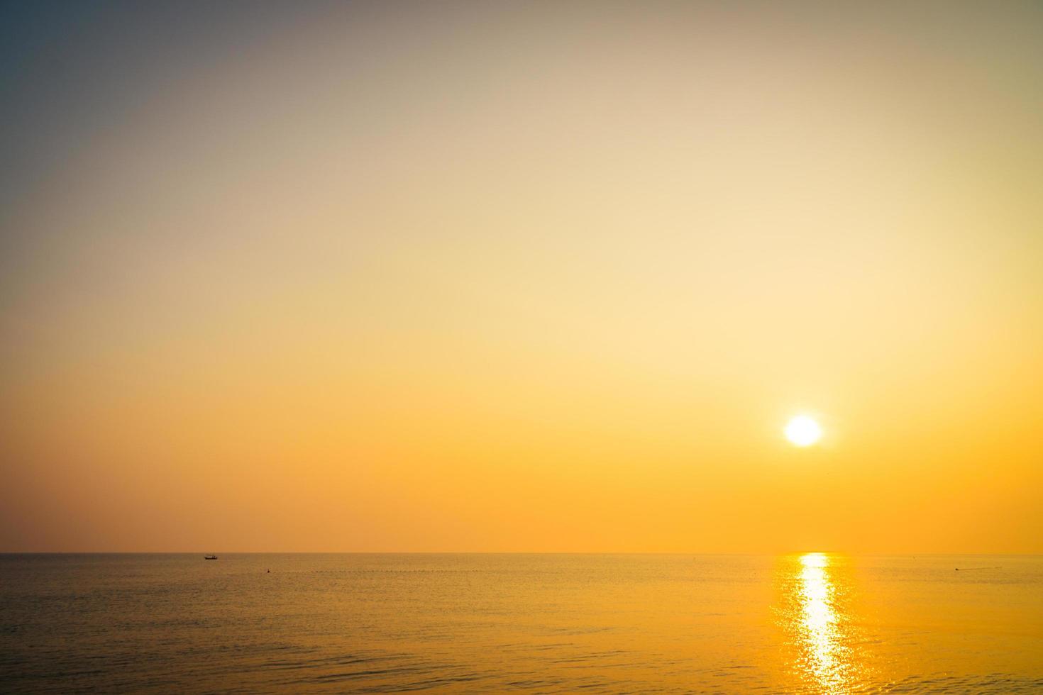 Beautiful sunrise on the beach and sea photo