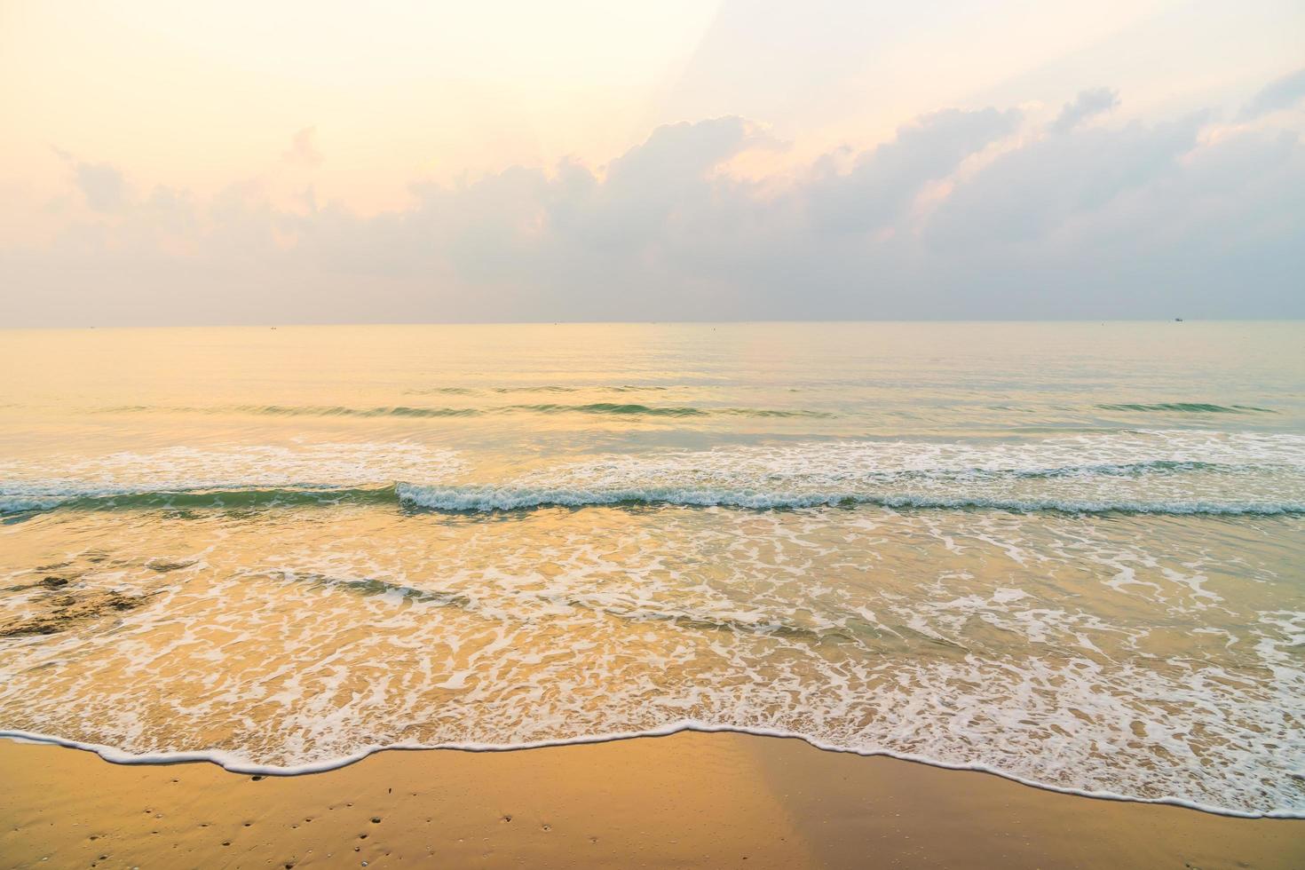 Beautiful beach and sea on sunrise time photo