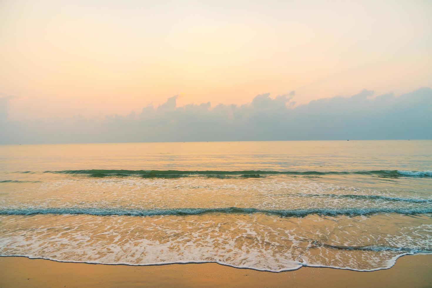 Beautiful beach and sea on sunrise time photo