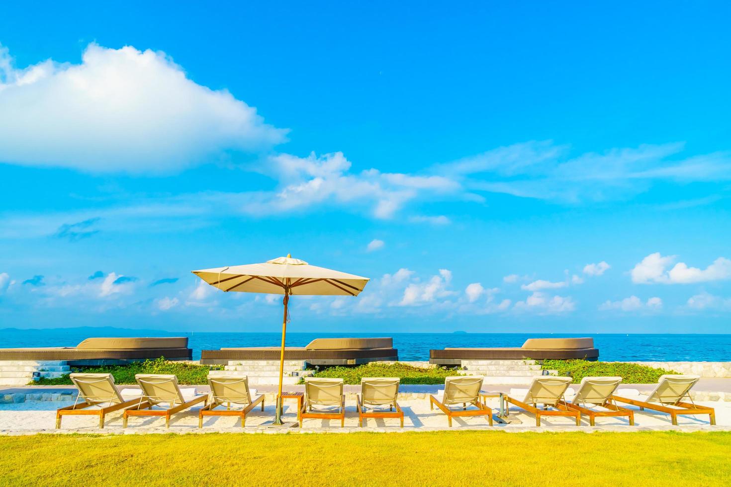 Umbrella and chair with sea view photo