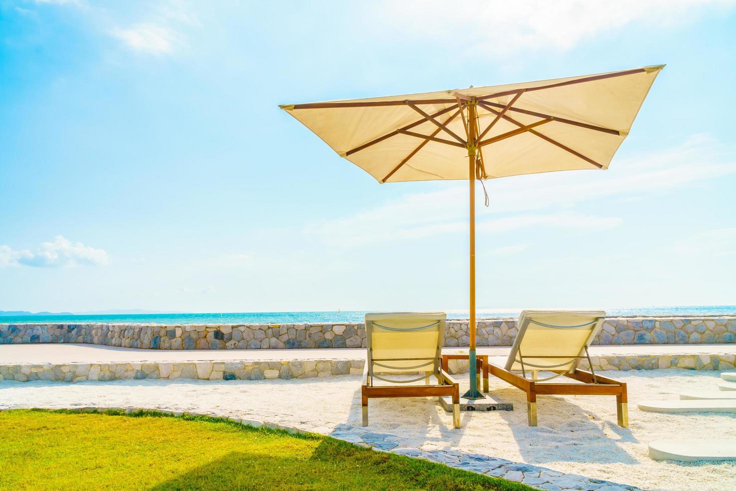 Umbrella and chair with sea view photo