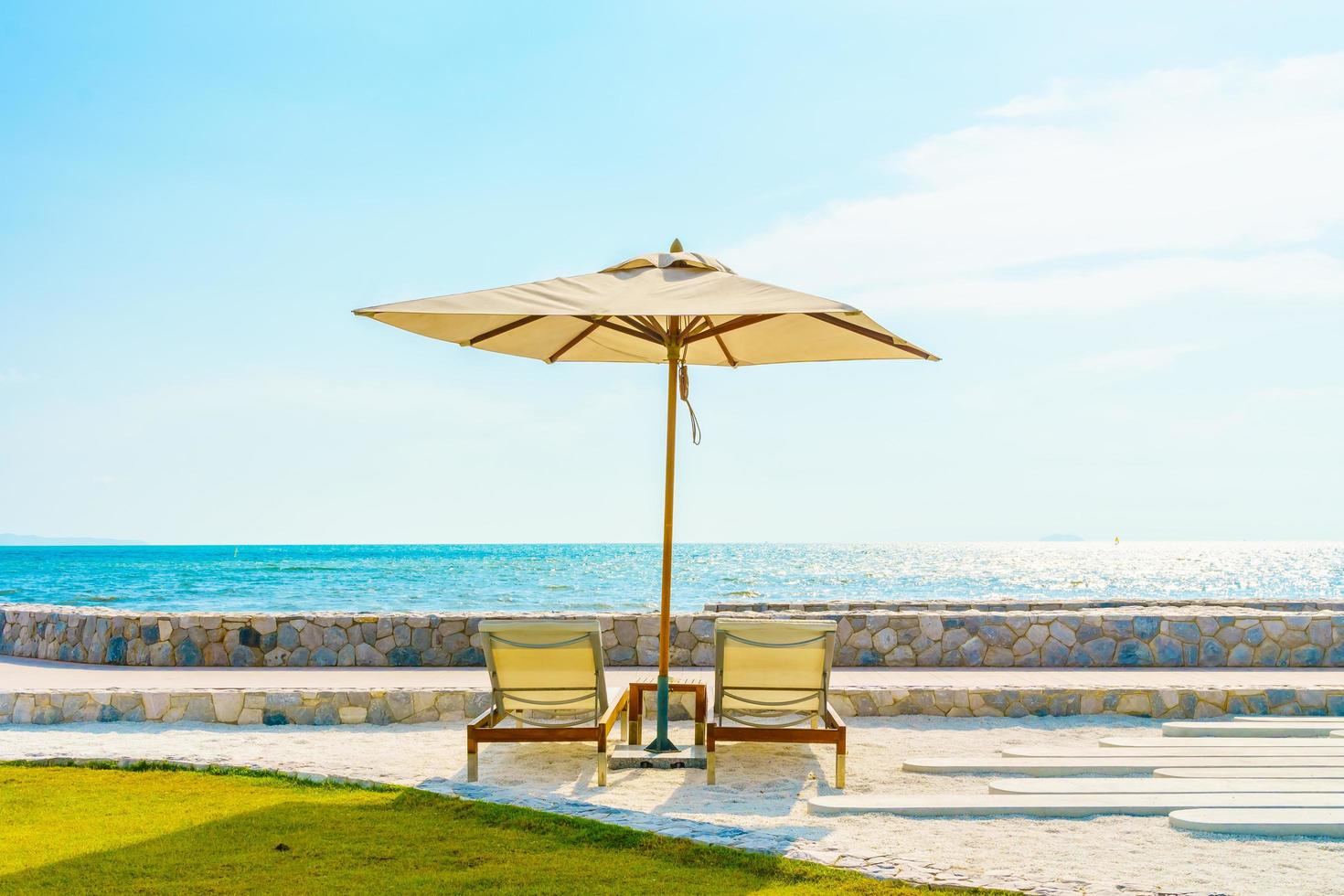 Umbrella and chair with sea view photo