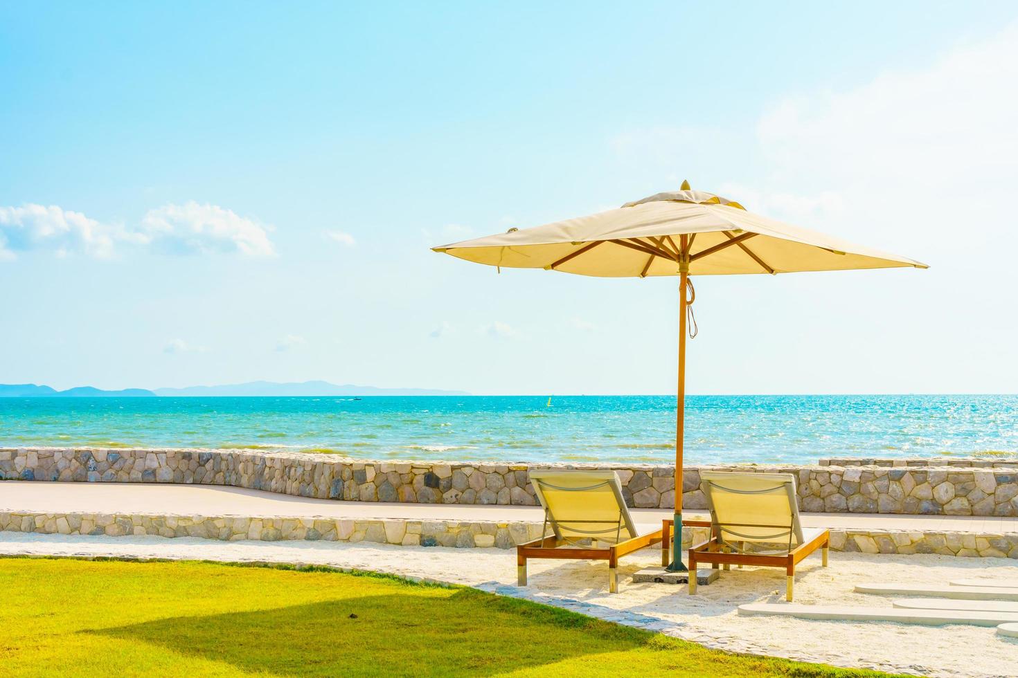 Umbrella and chair with sea view photo