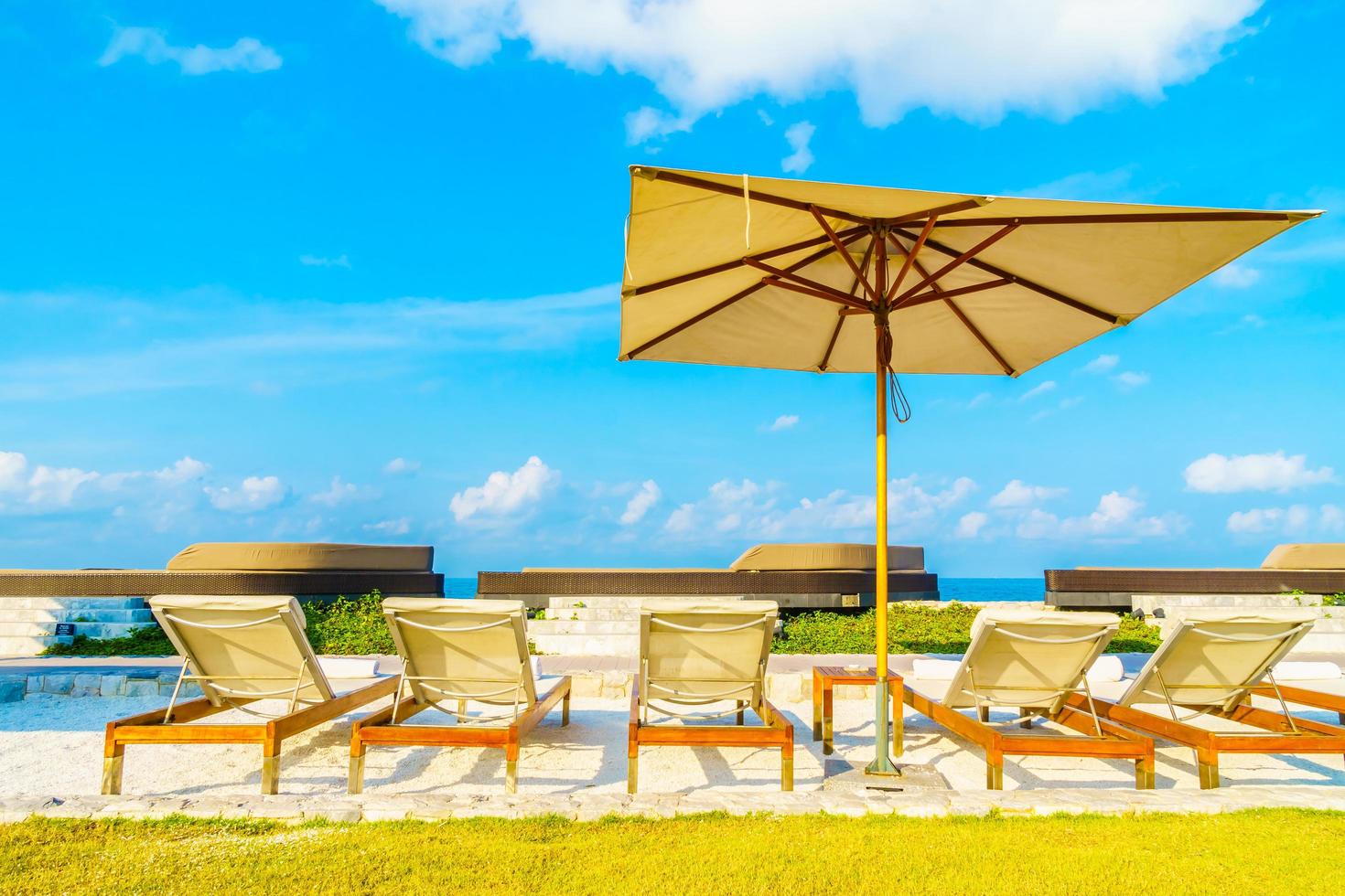 Umbrella and chair with sea view photo