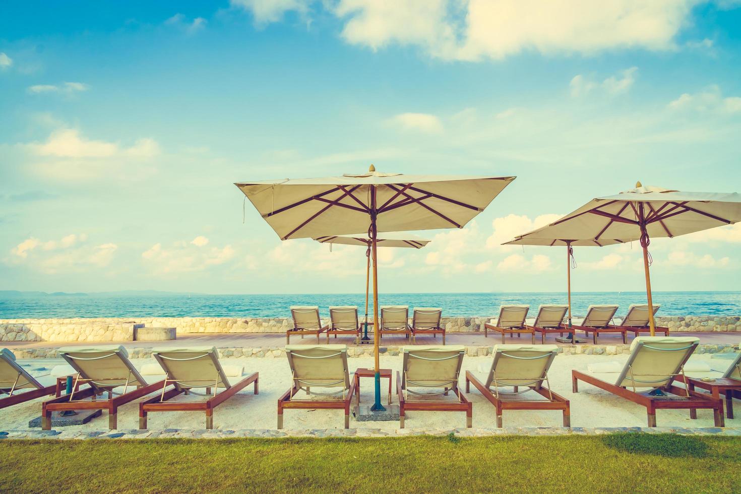 Umbrella and chair with sea view photo