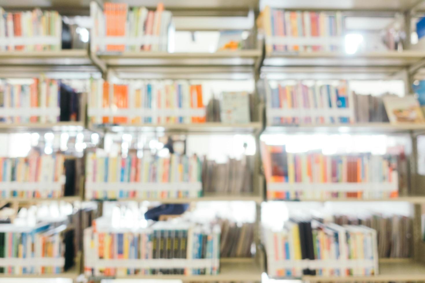 Abstract blur and defocused bookshelf in library photo