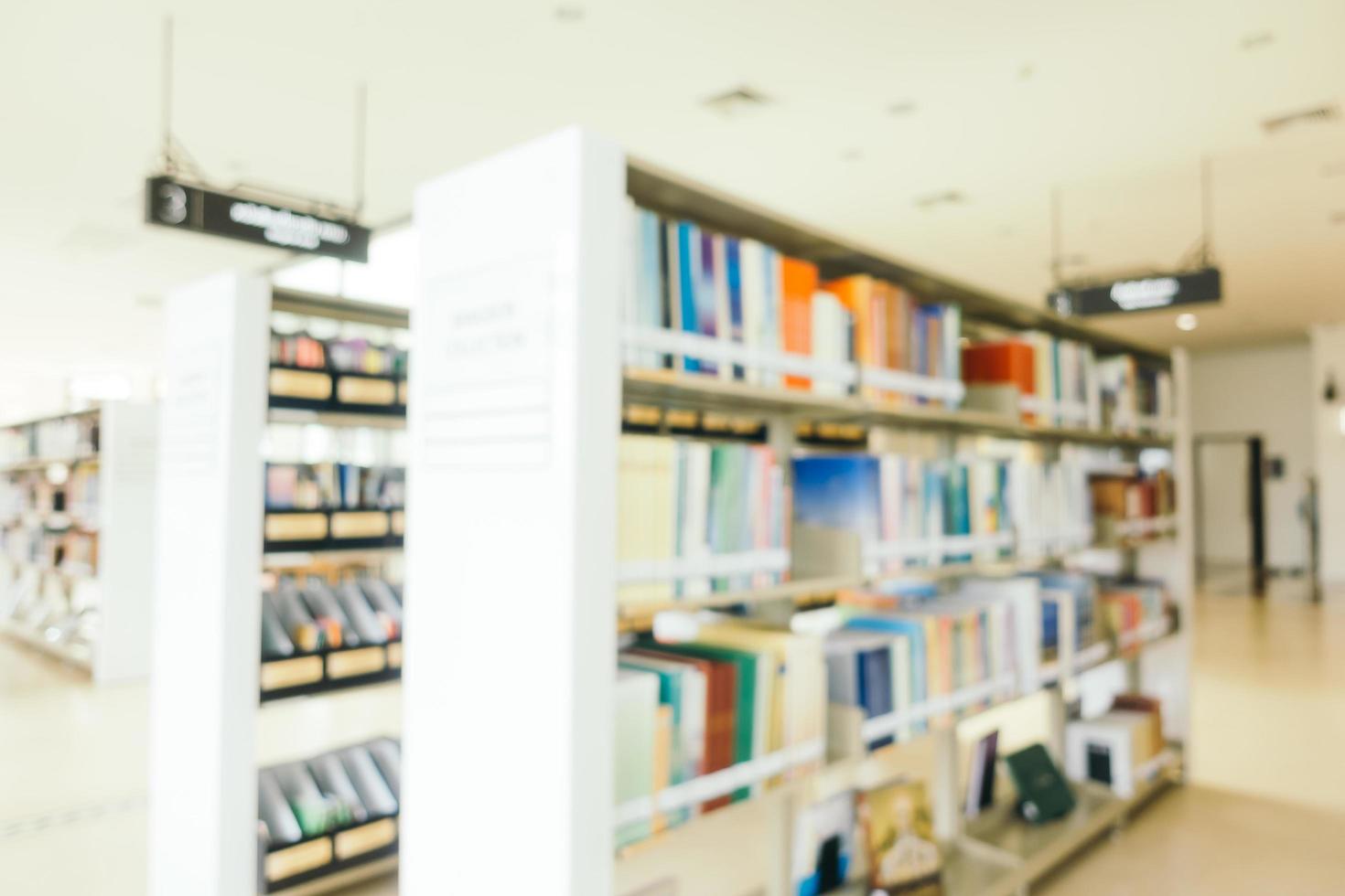 Abstract blur and defocused bookshelf in library photo