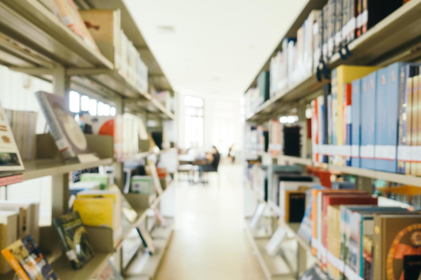 Abstract blur and defocused bookshelf in library photo