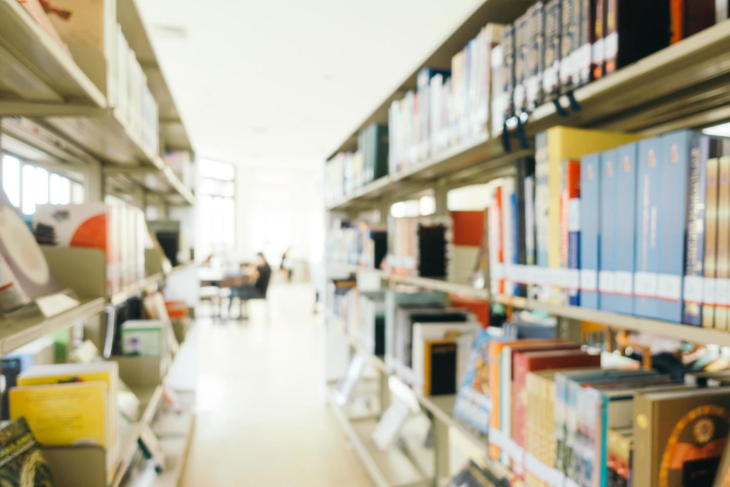 Abstract blur and defocused bookshelf in library photo