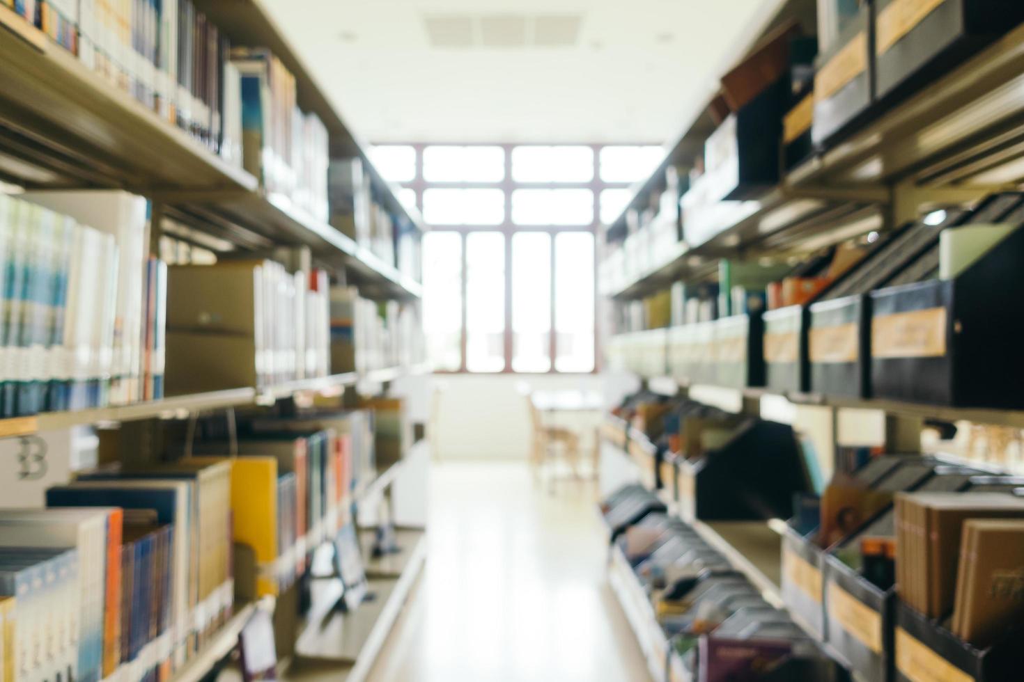 Abstract blur and defocused bookshelf in library photo