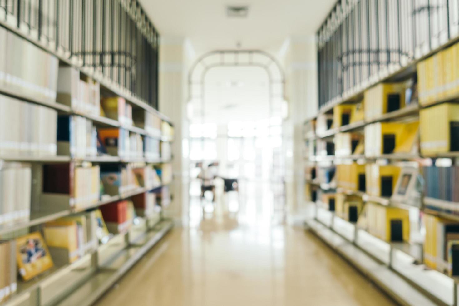 Abstract blur and defocused bookshelf in library photo