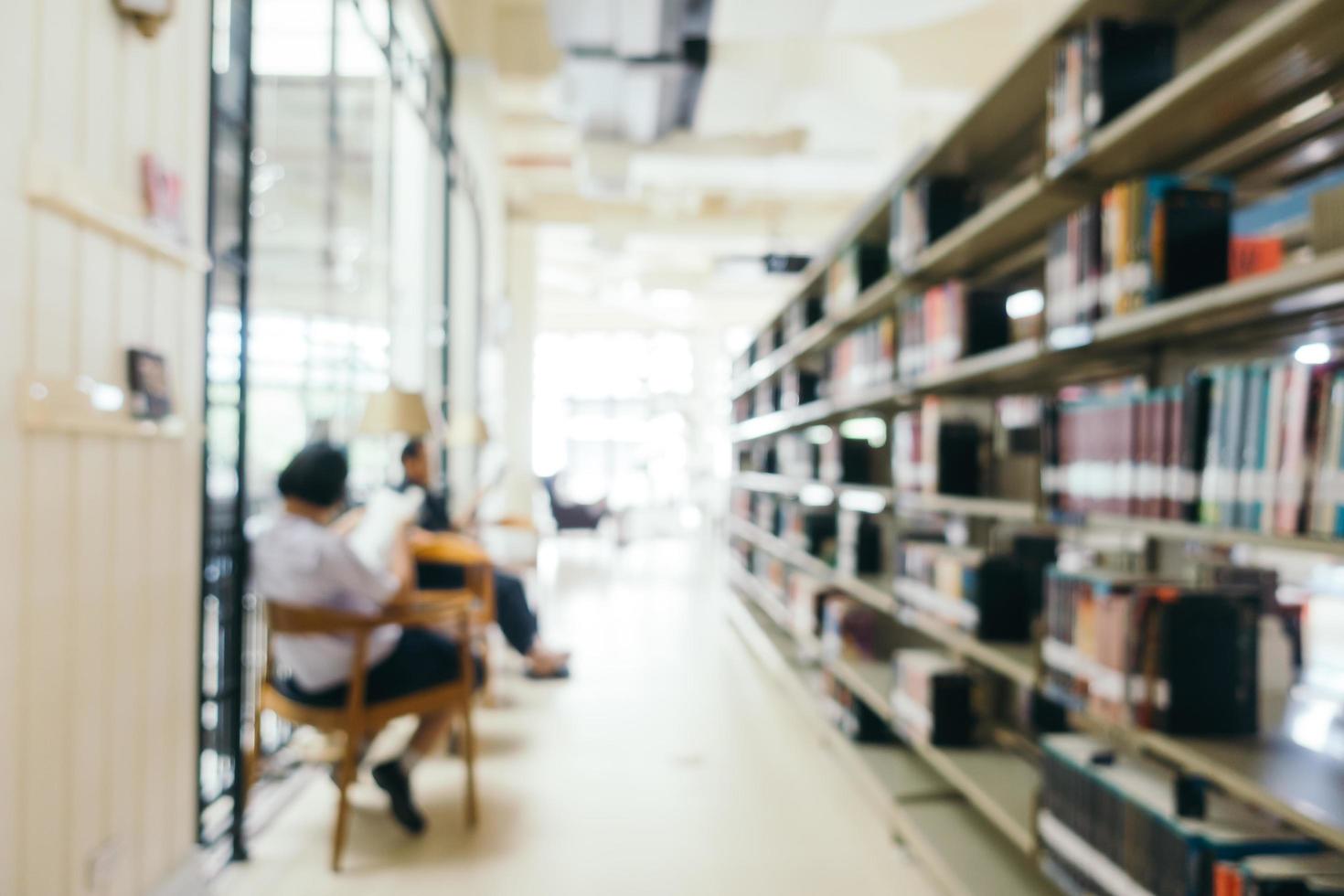 Abstract blur and defocused bookshelf in library photo