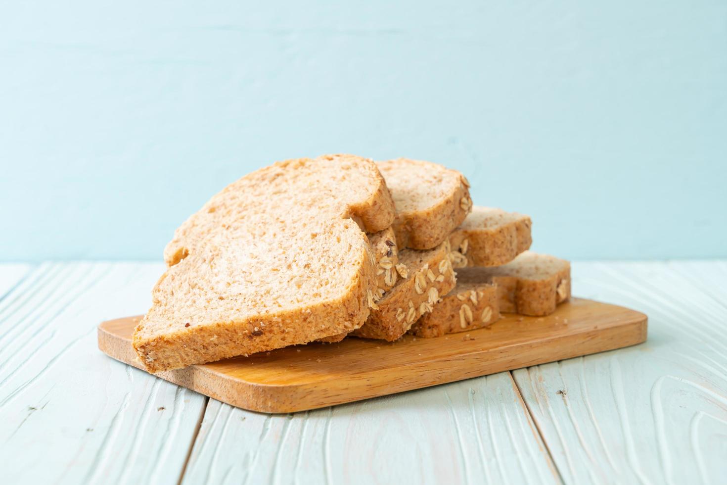 Sliced wholegrain bread on a wooden table photo