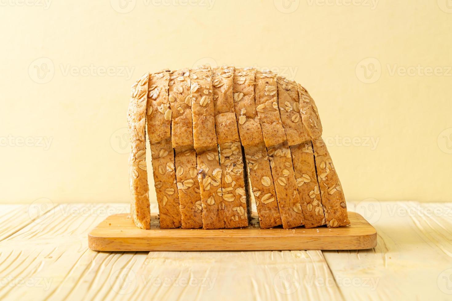 Sliced wholegrain bread on a wooden table photo