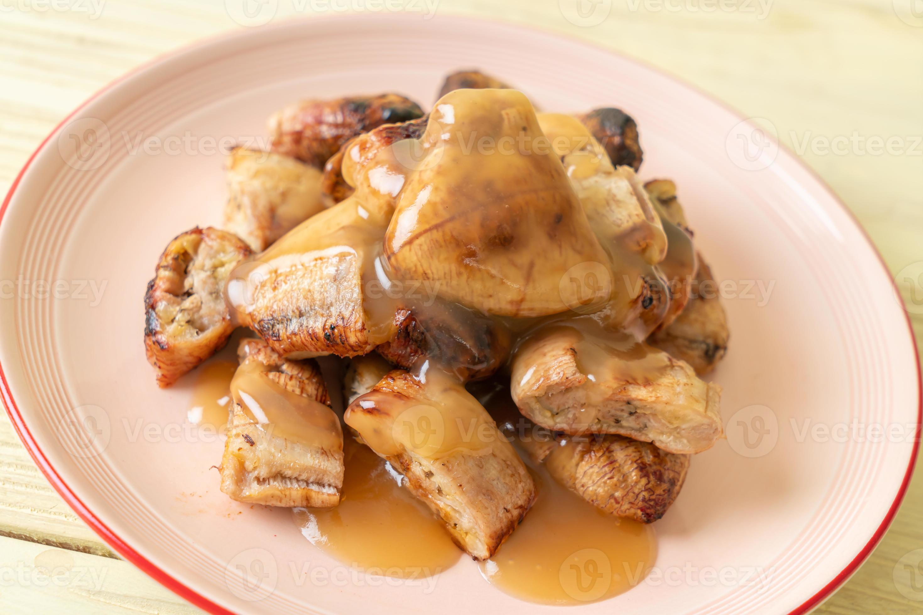 Grilled bananas with coconut caramel sauce on plate 2797649 Stock Photo at Vecteezy