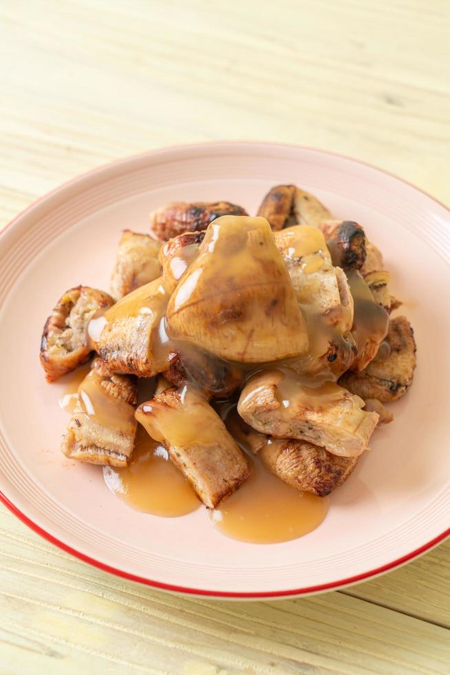 Grilled bananas with coconut caramel sauce on plate 2797666 Stock Photo at Vecteezy