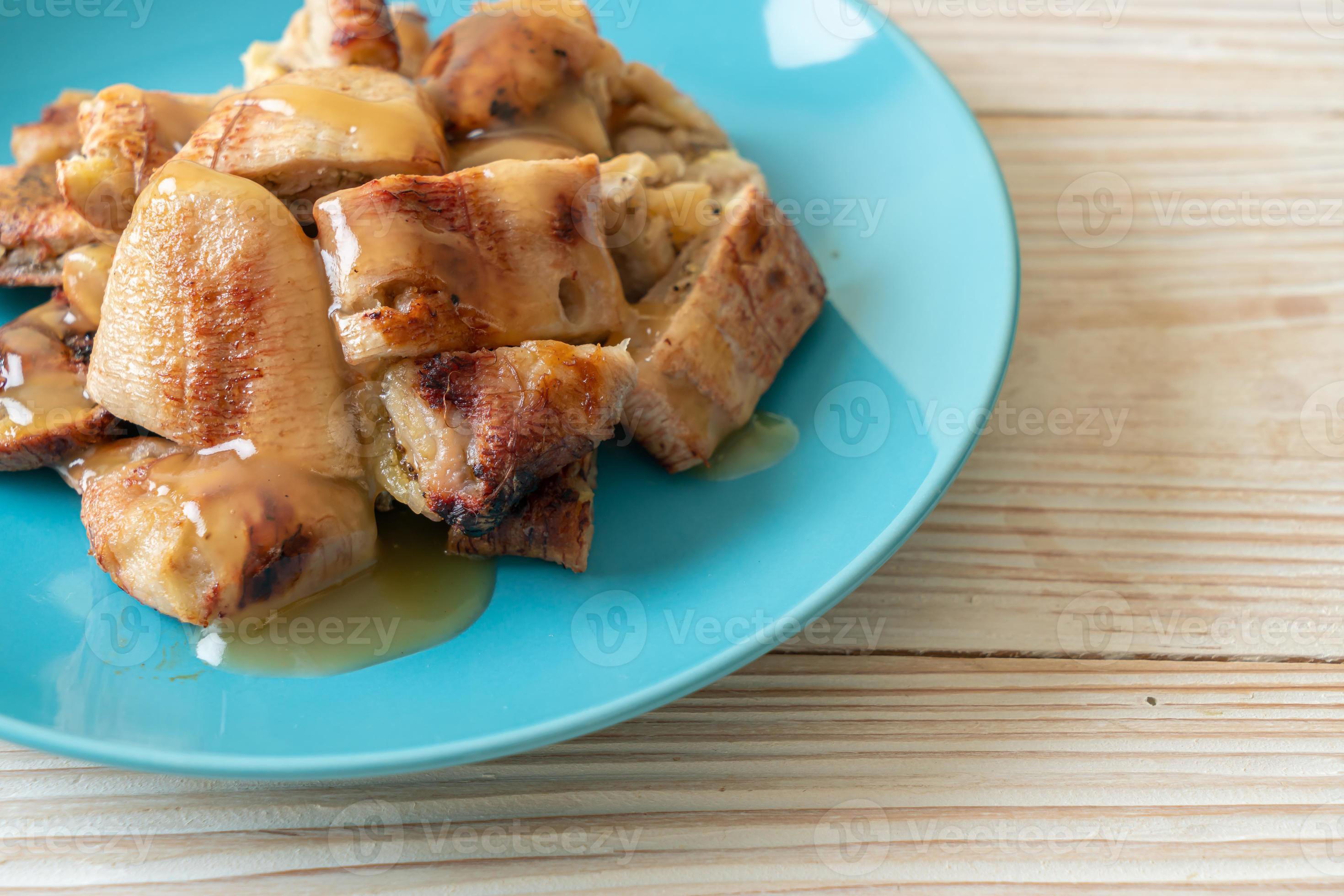 Grilled bananas with coconut caramel sauce on plate 2797669 Stock Photo at Vecteezy