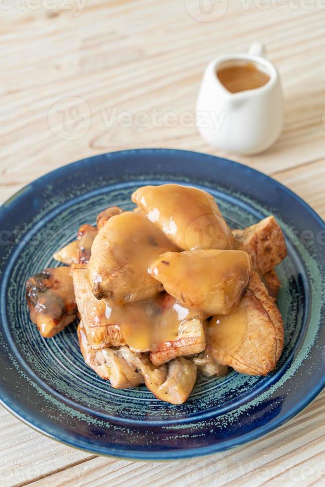 Grilled bananas with coconut caramel sauce on plate 2797684 Stock Photo at Vecteezy