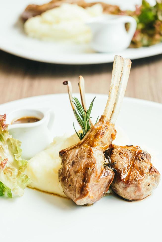 Grilled rack of lamb meat with sauce photo