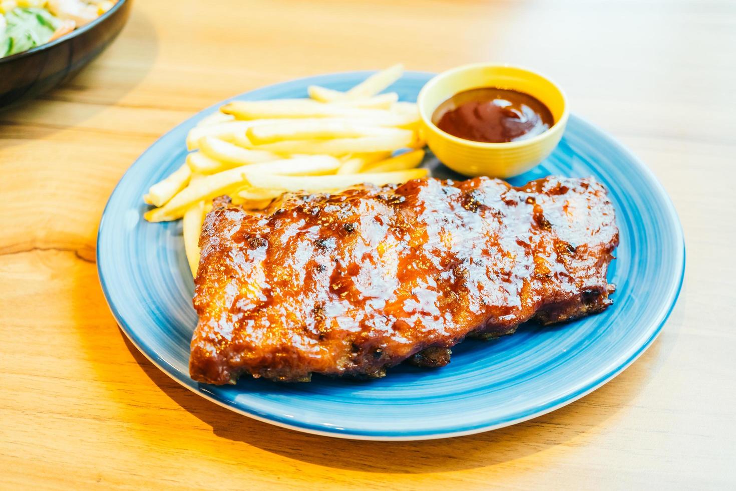 Grilled Bbq or Barbecue rib with french fries photo