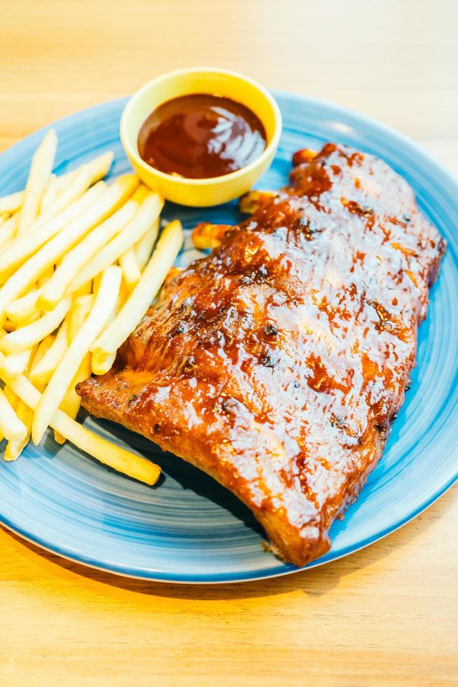 Grilled Bbq or Barbecue rib with french fries photo