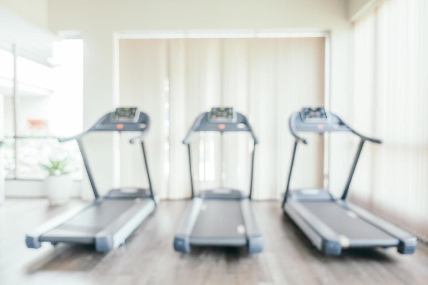 Abstract blur fitness equipment in gym room interior photo