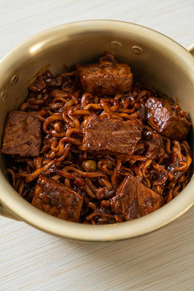 Jjapaguri or Chapaguri or Korean Black Beans Spicy Noodles with Beef photo