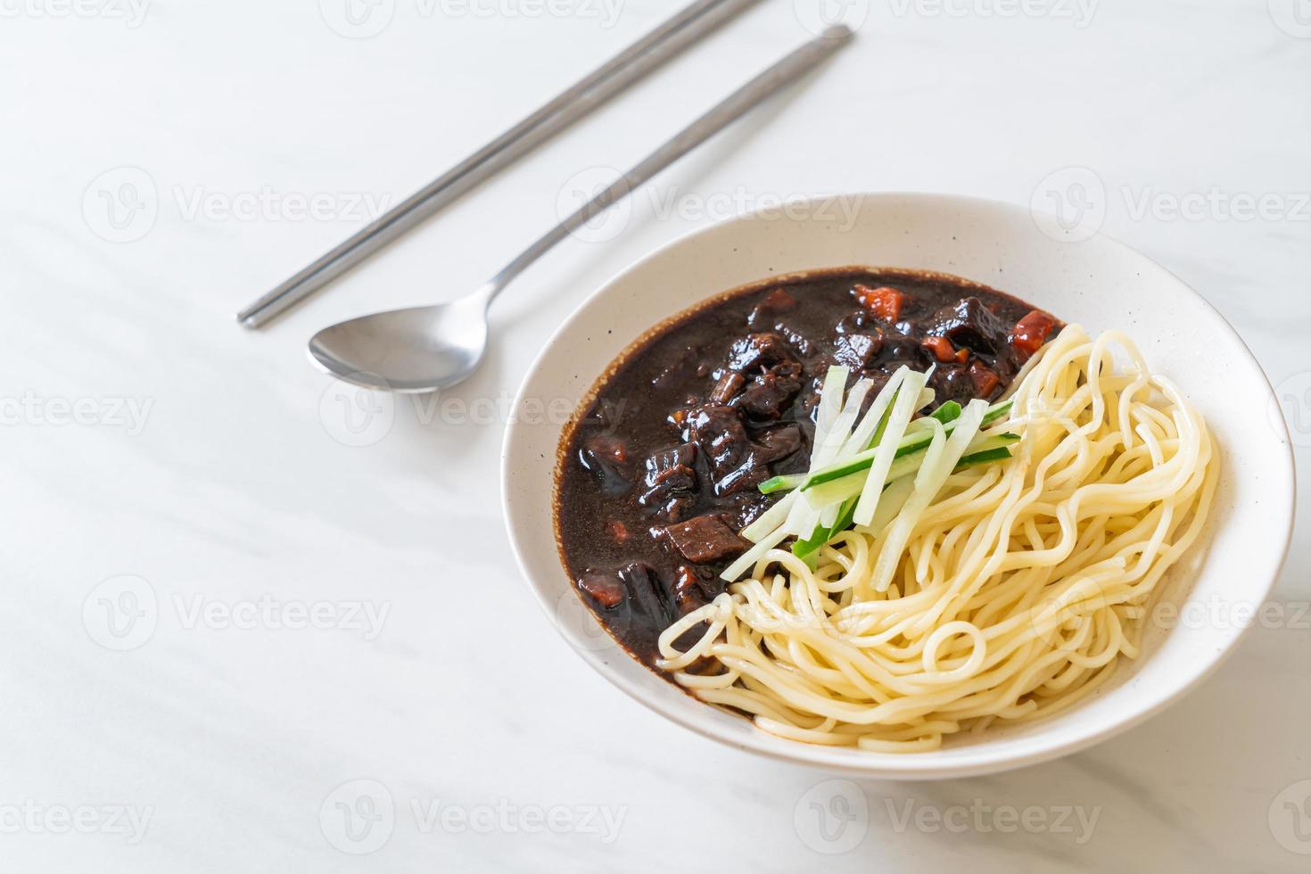 Jajangmyeon or JJajangmyeon is Korean Noodle with Black Sauce photo