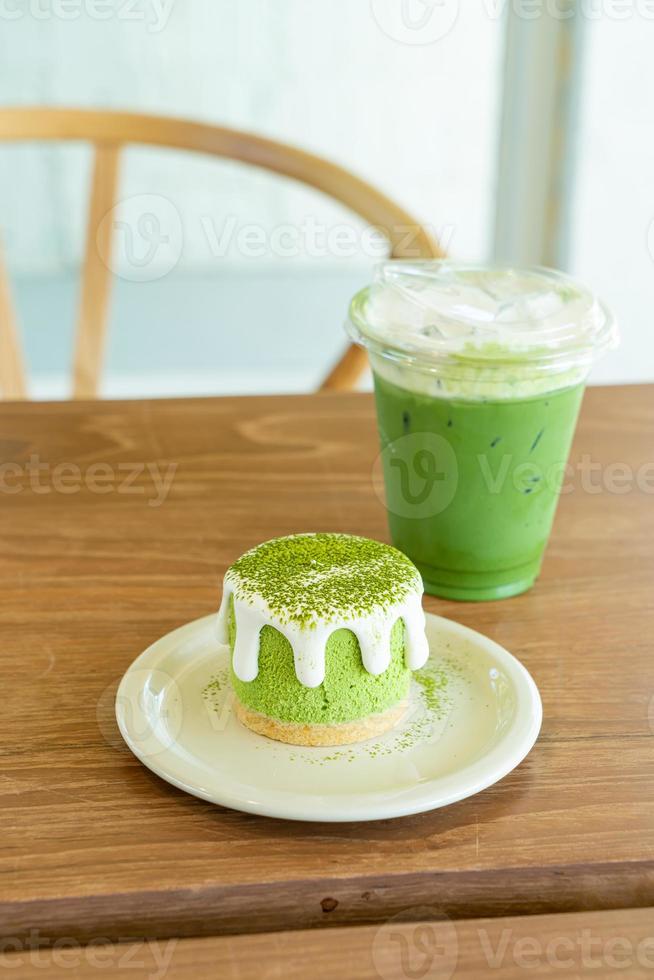 Matcha green tea cheese cake with green tea cup on table in cafe restaurant photo