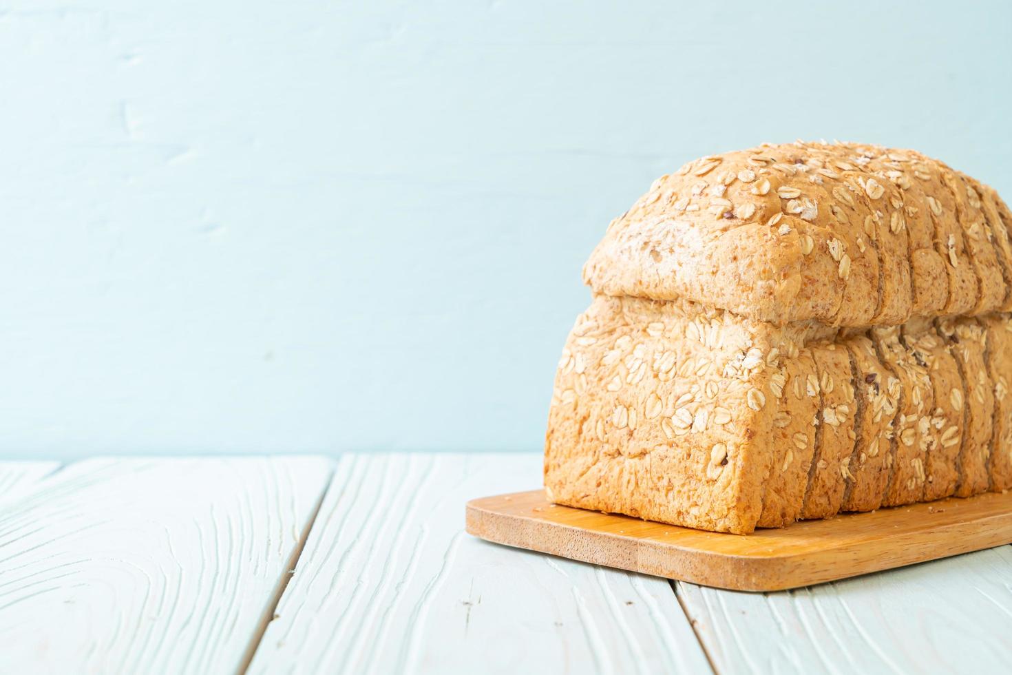 Sliced wholegrain bread on a wooden table photo